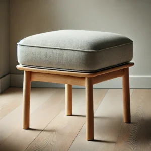DALL·E 2024-11-21 17.41.55 - A modern and elegant stool with a minimalist Scandinavian design. The stool features a soft, rectangular cushion upholstered in light grey fabric with